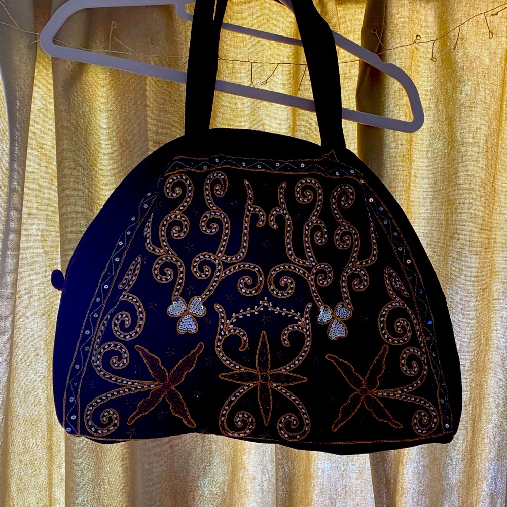 Velvet bag hand embroidered by Afghan women to support local girls’ school
